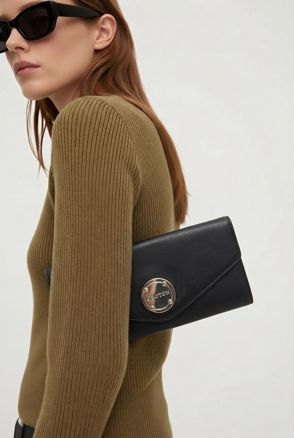 Oroton black leather clutch in box
