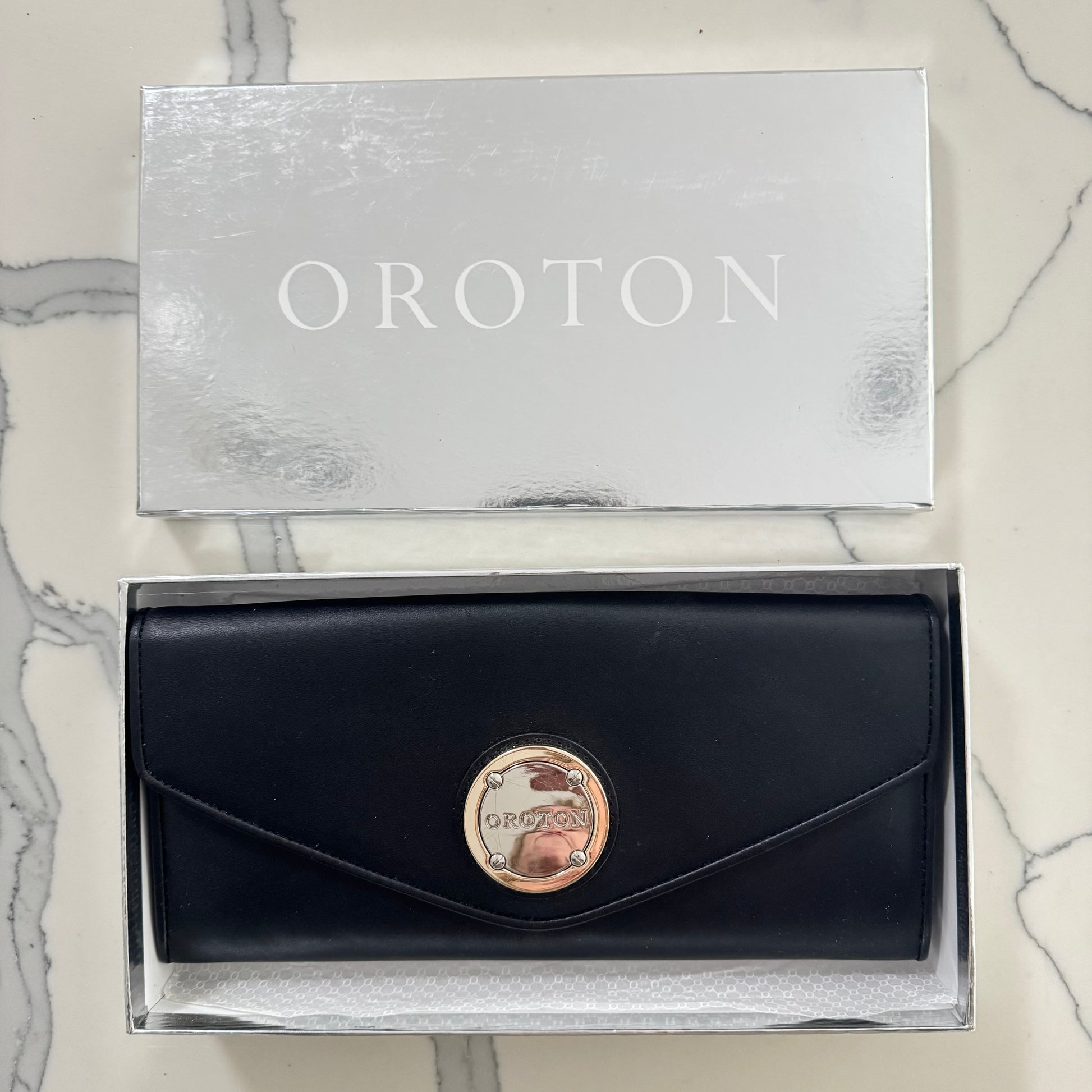 Oroton black leather clutch in box