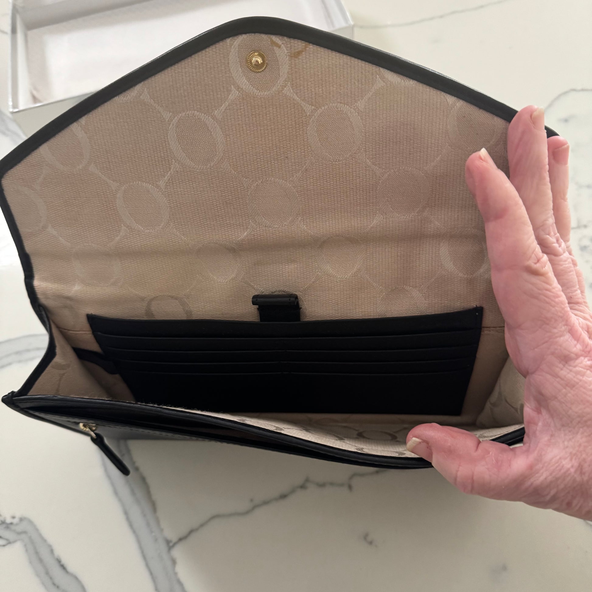 Oroton black leather clutch in box