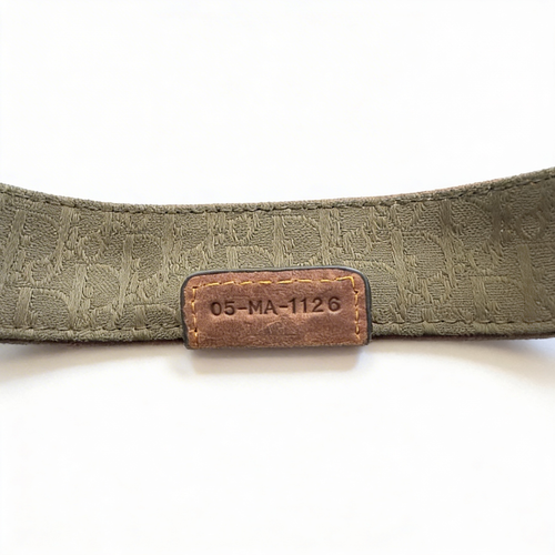 dior gaucho bag with a brown leather label on a white background
